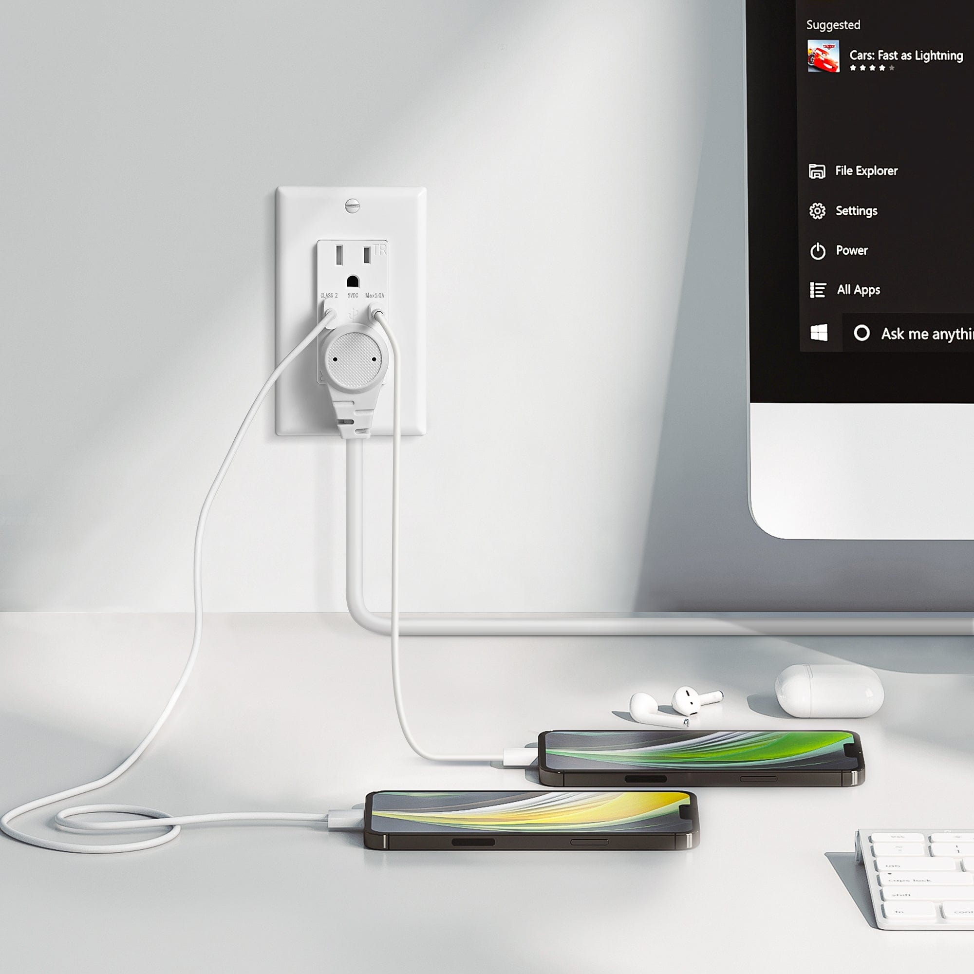 The wall outlet can power multiple mobile phones and devices simultaneously